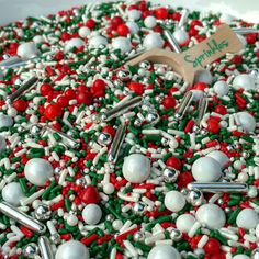 a cake decorated with red, white and green sprinkles