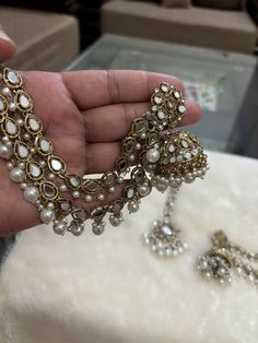 *Beautiful Premium Quality Long Earrings With Support Chain With Maangtikka *Combination Of Kundan and Monalisa Stones  *Front Side is Monalisa Stone With Kundan *Pearls And Kundan Are Of Original Quality *For More Beautiful Collection, Check At https://www.etsy.com/shop/placeoffashion *Earring Closure: Push Back *It is a Bridal or Partywear Earrings *It Will Give You a Unique and Beautiful Look  *You Can Wear This Beautiful Set At Dress or Saaree  *The Colour Combination Of This Set Is Very Uni Traditional Chandbali Earrings With Pearl Chain, Bollywood Pearl Chain Earrings For Festive Season, Eid Jewelry Sets With Chandbali Latkans, Festive Bollywood Pearl Chain Earrings, Eid Jewelry Sets With Latkans And Chandbali Shape, Bollywood Style Pearl Chain Earrings As Gift, Bollywood White Pearl Chain Earrings, Festival Celebration Earrings With Pearl Chain, Festive Celebration Earrings With Pearl Chain