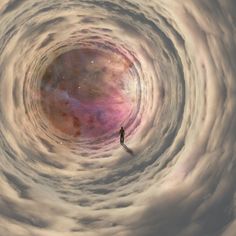 a man standing in the center of a vortex