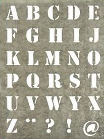 an old stone typeface with the letters and numbers in white on grey paper background