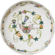 a white bowl with colorful designs on it's sides and an ornate design in the center