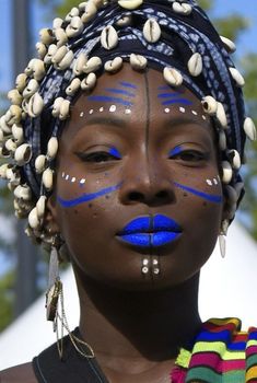 a woman with blue painted on her face