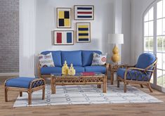 a living room with blue couches and chairs