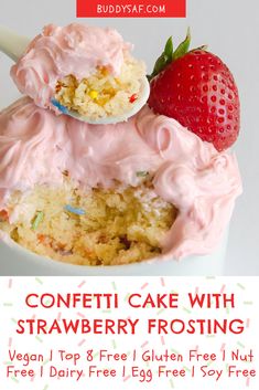 a strawberry cake in a cup with frosting and strawberries on top for free