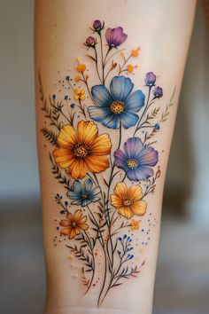 a woman's thigh with flowers painted on it