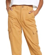 Know One Cares Drawstring Woven Cargo Pants In Mustard Relaxed Fit Yellow Pants With Pockets, Yellow Relaxed Fit Pants With Pockets, Spring Mustard Bottoms With Pockets, Mustard High-waisted Casual Pants, Yellow Cotton Bottoms With Side Pockets, Casual Yellow Pants With Pockets, Yellow Cotton Cargo Pants With Pockets, Yellow Cotton Cargo Pants, Yellow Cotton Pants With Cargo Pockets