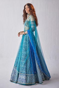 Blue can can attached lehenga with all over printed floral mughal motifs with sequin work. Comes with padded cut-out blouse and ombre dupatta.
Components: 3
Pattern: Printed
Type Of Work: Mughal
Neckline: Off shoulder
Sleeve Type: Three quarter
Fabric: Organza
Color: Blue
Other Details: 
Length: Lehenga: 44 inches
Model Height: 5ft 8inches wearing size XS
Closure: 
Blouse: Back hook
Lehenga: Side closure
Occasion: Sangeet,Cocktail - Aza Fashions Ombre Dupatta, Mughal Motifs, Floral Lehenga, Blue Organza, Set For Women, Aza Fashion, Model Height, Shoulder Sleeve, Wedding Outfit