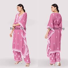 Nibs Tog Ryon Cotton Lucknowi Chikankari Kaftan Dress for Women Pink Beautifully crafted with different motifs of Chikankari, well finished with lace work, Presenting you this beautiful Chikankari Kaftan Dress Set with Bottom. Made of Soft ryon Cotton fabric. Check full details below. Shop More Chikankari outfits by Nibs Tog on our Shop : https://www.etsy.com/in-en/shop/NibsTog Fabric: The Kaftan is made of soft Ryon Cotton and it is not transparent fabric. Style: The outfit is style in Kaftan Look with a waist string to adjust. The Set includes one Kaftan and Straight Palazzo Pant with Chikankari Embroidery. Occasion: The Chikankari Kaftan Dress can be styles for any casual day, at home for your comfort or you can carry the Kaftan for Beach Cover Up, It can be Kaftan for Resort Wear and a Pink Anarkali Kaftan For Navratri, Pink Bollywood Kaftan With Dabka, Traditional Pink Kaftan With Traditional Drape, Bohemian Pink Embroidered Palazzo Set, Bohemian Embroidered Pink Palazzo Set, Traditional Tunic Palazzo Set For Navratri, Traditional Pink Georgette Kaftan, Pink Anarkali Kaftan For Festivals, Traditional Pink Tunic Sets