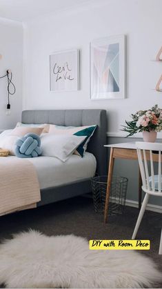 a bedroom with a bed, desk and pictures on the wall