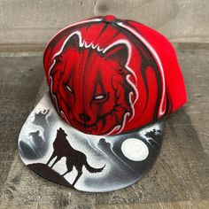 This is an airbrushed snapback hat featuring a red wolf design.  This hat is adjustable and will fit almost anyone.  These hats are waterproof and can withstand a good soaking but they should not be washed in a washing machine or dish washer.  Thank you, Brad.  Shipping is free for this item anywhere in the US. Custom Snapback Baseball Cap For Outdoor, Red Flat Brim Fitted Hat For Outdoor, Red Snapback Fitted Hat For Outdoors, Red Adjustable Hip Hop Fitted Hat, Red Hip Hop Hat, Red Hip Hop Fitted Hat With Flat Bill, Red Snapback Baseball Cap For Outdoor, Red Hip Hop Fitted Hat For Streetwear, Red Fitted Hat For Streetwear