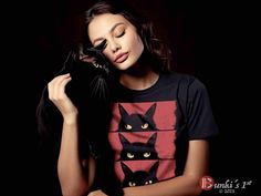 Embrace the charm of grumpy cats with this delightful and funny Cat Lover, Grumpy Black Kitten, Cat Mom, Cat Dad T-Shirt, perfect for all feline enthusiasts. A unique gift for cat moms and dads for any occasion. This eye-catching design features a black cat on a vibrant red background, adding a pop of color to your style. Available for toddlers, kids, and adults, this t-shirt comes in a variety of sizes to suit everyone in the family. Get ready for Halloween with the matching hoodie, featuring t Funny Black Top With Cat Design, Funny Black Cat Design Top, Funny Black T-shirt With Cat Design, Kitten Black, Cat Mom Shirt, Cat Mom Shirts, Black Kitten, Cat Tee, Cat Lover Gift