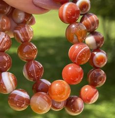 Fine Quality Carnelian Beaded Bracelet . Each one is stunning in color, hand picked and so unique. Approximate size of the bead is 12mm. You will receive 1 Intuitively picked bracelet!      📌 Science & Origin : These are hand picked to show unique patterns. Beautifully polished and shaped to facilitate meditation. Not one will be the same!  📌 You will receive : 1 Pictured Crystal  *You will get the same one that is in the picture. (There will be little differences in color under different ligh Iolite Stone, Fancy Lights, Carnelian Beads, Quartz Bracelet, Faceted Gemstones, Hand Picked, Bead Bracelet, Unique Patterns, Beaded Bracelet