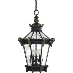 an old fashioned hanging light fixture with two birds on the front and one bird on the back