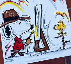 a drawing of a cartoon character holding a paintbrush in front of a fire extinguisher