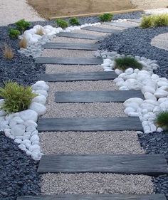 a walkway made out of rocks and gravel