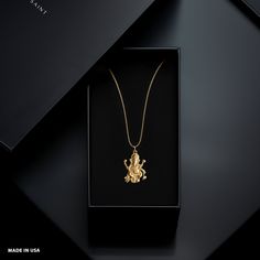 Elevate your style with our Ganesh pendant. This solid gold Ganesh necklace captures the essence of the Elephant. PENDANT INFORMATIONThis pendant is made of real, solid gold.• Made in USA• Material: 14k or 18k solid gold• Finish: polished• Height: 1.25" (32 mm) x Width: 0.9" (22,5 mm)• Pendant weight: approx. 6 grams (14k)• Bail: fits up to 4 mm chains• Solid back, not hollow• A certificate of authenticity is included• Delivered in our elegant jewelry box, making it the perfect gift Shipping: Al Luxury Temple Necklace As Gift, Gold Temple Necklace In Sterling Silver As A Gift, Gold Sterling Silver Temple Necklace Gift, Spiritual Gold Plated Temple Necklace As Gift, Ganesh Necklace, Ganesh Pendant, Phoenix Pendant, Religious Symbols, Gold Dragon