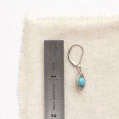 Sweet simplicity. Bright turquoise stones are wrapped in my signature herring bone style. Dainty and delicate. Leverback earwires. Measure 1 1/4”. Sterling silver, which has been oxidized and hand polished for an antique finish. About Turquoise: The name turquoise means "Turkish stone" because the trade route that brought it to Europe came via Turkey. Turquoise is a non-translucent stone of which the most valuable specimens are robin's egg blue or deep-blue azure. It also comes in brown, yellow, Minimalist Turquoise Wire Wrapped Earrings, Robin's Egg Blue, Bright Turquoise, My Signature, Turquoise Stones, Robins Egg Blue, Antique Finish, Turquoise Earrings, Turquoise Stone