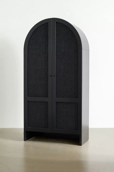 a black and white cabinet sitting on top of a table