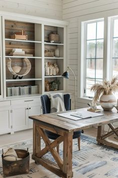 a living room filled with furniture and a book shelf on top of a wooden table