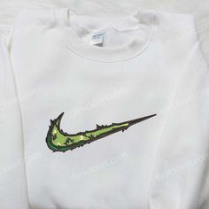 Introducing the Leaves and Flowers x Nike Swoosh Embroidered Hoodie, a fusion of nature and sportswear. Made with premium materials, this hoodie showcases a unique embroidered design that combines the iconic Nike Swoosh with delicate leaves and flowers. Its cozy fit and soft fabric ensure ultimate comfort, while the eye-catching embroidery adds a touch of elegance. Stand out from the crowd with this one-of-a-kind hoodie that seamlessly blends style and performance. Elevate your wardrobe with our Best Birthday Gift Ideas, Nike Inspired, Best Birthday Gift, Best Birthday Gifts, Adulting Shirts, Nike Swoosh, Embroidered Hoodie, Cozy Fits, Nike Hoodie