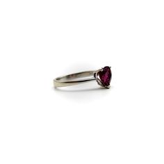 This is part of Chairish’s Fine Jewelry assortment.  This 18k white gold ring features a beautifully coloured heart-shaped garnet. The garnet is a saturated deep magenta, with facets that sparkle in many different hues of pink and red. It is prong set with three prongs; the back of the carriage or underside of the ring is a heart shape as well, for an adorable added touch. A wonderful sweetheart ring , this is the perfect gift to show someone your love or your self love.  The rings weighs 2.9 gr Elegant Heart-shaped Amethyst Ring, Elegant Amethyst Heart-shaped Birthstone Ring, Elegant Heart-shaped Amethyst Ring For Valentine's Day, Classic Heart-shaped Ruby Ring For Formal Occasions, Classic Heart-shaped Ruby Ring, Heart Shaped Solitaire Ring For Formal Occasions, Formal Heart Shaped Solitaire Ring, Formal Heart-shaped Solitaire Rings, Heart-shaped Birthstone Ring For Formal Occasions