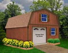 a red garage with yellow flowers in the front yard and green grass on either side