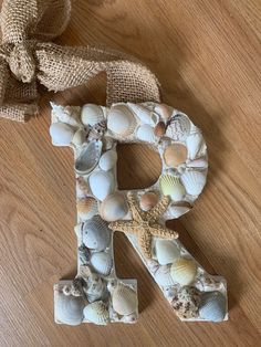 the letter n is made out of seashells