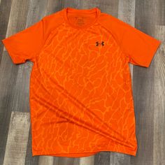 Under Armour Tshirt Size S Lightweight Brand New Without Tags Orange Crew Neck Sports Top, Orange Sporty Crew Neck Top, Orange Crew Neck T-shirt With Moisture-wicking, Under Armour Crew Neck T-shirt With Logo, Casual Orange Moisture-wicking Tops, Orange Moisture-wicking Short Sleeve Tops, Orange Short Sleeve Moisture-wicking Top, Orange Graphic Print Short Sleeve Shirt, Orange Short Sleeve Graphic Tee