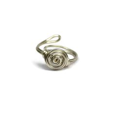 Wire wrapped Rose ring made in your choice of antique brass, gunmetal, or silver. Makes a great gift or stocking stuffer because you don't have to ask the receiver their ring size. It is one size fits most! Adjustable design made with 18g non tarnish wire. Rings are one size fits most and are adjustable. Ring appears larger in photos to show detail. Since each ring is handmade and gemstones vary in color tone and pattern, there may be slight differences in each ring. Your order will be made and Wire Wrapped Rose, Wrapped Rings, Silver Wrap Ring, Rose Ring, Rose Jewelry, Wire Wrapped Rings, Gift For Girls, Wrap Rings, Adjustable Ring