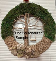 a rope wreath with a tree on it and the words not personalized sample below