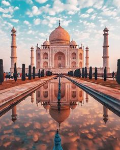 an image of the tajwa in india with its reflection on the water surface