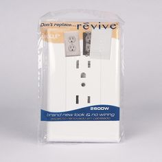 two white electrical outlets in packaging on a gray background