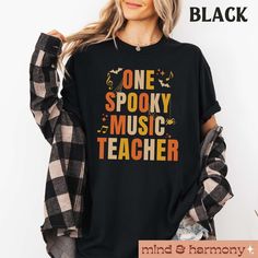 This music teacher Halloween design is sure to stand out this fall season. This tee is full of comfort and made with colors and sizes for men and women. Don't wait too long to snatch this trendy t-shirt before the spooky season ends. FIT & SIZING: * This garment dyed unisex t-shirts have just the right amount of cozy comfort. * Tees are comfortable and flattering for both men and women. * Please see the size chart in the photos to obtain an accurate size. Measure one of your favorite tees for co Fall Music-themed Graphic Print T-shirt, Fall Music-themed Cotton Tops, Teacher Halloween, Teachers Halloween, Music Student, Fall Tee, Music Teacher, Teacher Tshirts, Trendy Tshirts