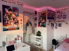 a bedroom with posters on the wall