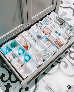 an open drawer with various items in it