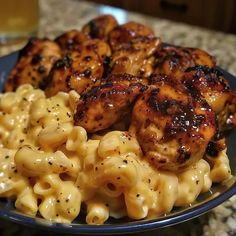 some chicken and macaroni are on a plate