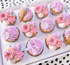 cupcakes decorated with pink and purple frosting