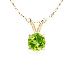 Crafted in 14k yellow gold, this classic solitaire peridot pendant showcases captivating beauty. Linked to a lustrous v-bale is a four-prong set peridot that mesmerizes with its earthy green hue. Christmas Jewelry Gift, Natural Opal Ring, Moldavite Jewelry, Earthy Green, Silver Gold Jewelry, Peridot Jewelry, Peridot Pendant, Peridot Necklace, Versatile Jewelry