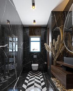 a bathroom with black and white tile flooring and walls, along with a large window