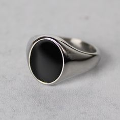 Premium Stainless Steel Color: Steel Black Front Is Enamel 16mm X 12mm Width Available Sizes 7 / 8 / 9 / 10 / 11 / 12 (View Size Guide Or Choose Your Us Ring Size) Safe In Water Sleek Silver Rings With Polished Finish, Silver Oval Signet Ring For Everyday, Everyday Black Sterling Silver Signet Ring, Modern Silver Signet Ring With Black Enamel, Minimalist Oval Stainless Steel Jewelry, Classic Silver Stainless Steel Signet Ring, Formal Silver Signet Ring With Black Enamel, Elegant Silver Stainless Steel Signet Ring, Everyday Black Signet Ring With Polished Finish