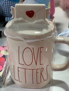 a coffee mug with the words love letters on it