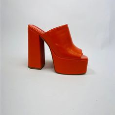 Brand New, Never Used Only Tried On In Store. Fits True To Size. Will Update Photos Soon! Fall In Luv With The The Luna Luv Platform Mule In Orange! These Chunky Open-Toe Platforms Are Both Playful And Elevated, And Pair Perfectly With Any Flare Style Pant. Pair It With A Light Washed Jean For A Daytime Look Or Channel Your Y2k Vibes And Pair Them With Your Favorite Mini Skirt! Faux Leather Upper With Manmade Sole Slip-On Styling Leather Lining Approx 5.25 Inch Heel Approx 2 Inch Platform Chic Mules With Red Sole, Casual Heels With Red Sole For Spring, Orange Platform Heels With Round Toe, Spring Leather Heels With Red Sole, Trendy Red Sole Heels, Spring Synthetic Heels With Red Sole, Bold Spring Formal Heels, Spring High Heel Mules With Red Sole, Orange Platform Heels With Closed Toe