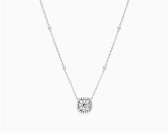 14K White Gold Cushion Halo Cluster Necklace. This dainty and elegant cushion halo composite pendant is perfect for every day wear. Beautifully crafted and prong set with round brilliant cut diamonds. Suspended by a delicate adjustable chain with four stations of round brilliant cut diamonds bezel set. aka Diamond Necklaces Classic White Gold Solitaire Necklace With Halo, Classic White Diamond Necklace With Halo, Classic Solitaire Necklace In White Gold With Halo Design, Classic Solitaire Halo Necklace, White Gold Necklace With Cushion Cut Halo Setting, White Gold Cushion Cut Necklace With Halo Setting, Classic White Halo Diamond Necklace, Classic Diamond Necklace With Halo Design, Classic Solitaire Necklace With Halo For Formal Occasions