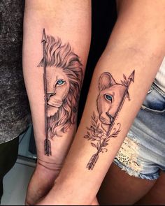 two people with tattoos on their arms and one is holding an arrow, the other has a lion