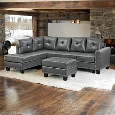 a living room with a sectional couch and ottoman