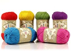 four balls of yarn in different colors and sizes on a white background with the words alize written across each ball