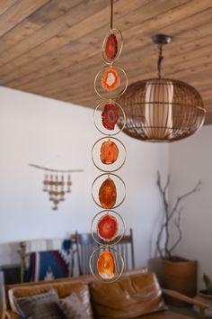 a chandelier hanging from the ceiling in a living room