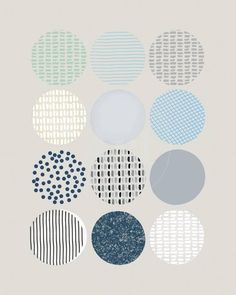 an art print with different circles and dots in blue, green, gray and white