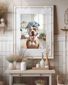 a dog with a towel on it's head sitting in front of a mirror