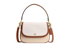 COACH Legacy Shoulder Bag in Color Block - Shoulder Handbags : Ivory Multi : Please Note: COACH items cannot be shipped to military addresses (APO or FPO) and addresses in Hawaii, the Virgin Islands, Guam or any other locations outside of the continental US. Fashion meets function in the COACH Legacy Shoulder Bag in Color Block! Constructed in refined pebble leather and highlighting a striking color-block design, the bag features a detachable short strap and a detachable and adjustable shoulder strap, offering versatile styling options. Snap closure. One zippered interior pocket. One exterior open pocket. Fabric lining. Imported. Measurements: Bottom Width: 2 3 4 in Depth: 10 in Height: 7 1 4 in Strap Drop: 21 1 2 in Handle Drop: 7 1 2 in Elegant White Flap Shoulder Bag, Elegant White Flap Bag, Classic Beige Flap Bag, Coach Cream Shoulder Bag With Top Carry Handle, Classic Cream Coach Satchel, Formal Beige Coach Shoulder Bag, Classic Coach Beige Satchel, Summer Bag Essentials, Crossbody Designer Bag